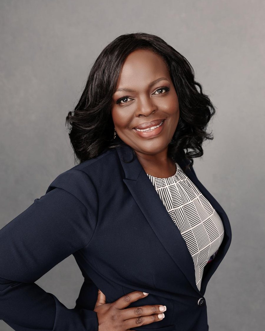 Dr. Jane Paul smiling in a navy blazer